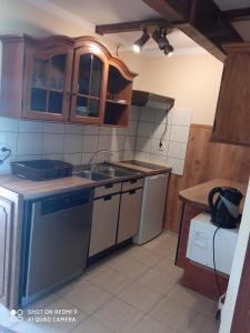 a kitchen with a sink and a stove at P-4 in Retowo