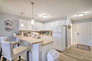 A kitchen or kitchenette at Screened Balcony with Views Sleek Lake Ozark Gem!