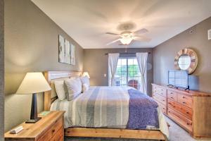 A bed or beds in a room at Screened Balcony with Views Sleek Lake Ozark Gem!