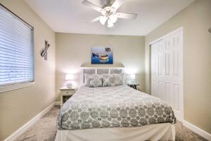 A bed or beds in a room at Screened Balcony with Views Sleek Lake Ozark Gem!