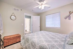 A bed or beds in a room at Screened Balcony with Views Sleek Lake Ozark Gem!