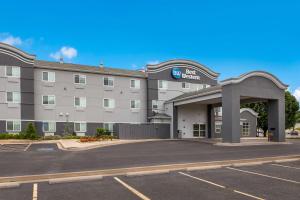 an image of a hotel with a parking lot at Best Western NSU Inn in Tahlequah