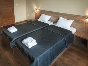 מיטה או מיטות בחדר ב-Family Hotel Pautalia