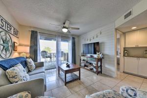 a living room with a couch and a table at Ocean-View Resort Condo with Pool and Beach Access in Fernandina Beach