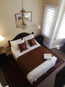 מיטה או מיטות בחדר ב-Belle Epoque Hostal