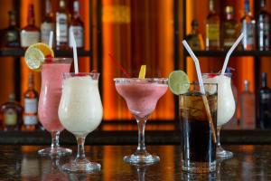 a group of four cocktails sitting on a bar at Rosen Inn Lake Buena Vista in Orlando