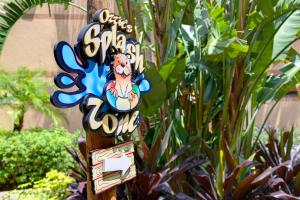 a sign for a santa cruz club at Rosen Inn Lake Buena Vista in Orlando