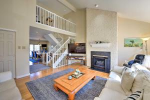 a living room with a white couch and a fireplace at Brigantine Beach Block Townhome with 3 Balconies! in Brigantine