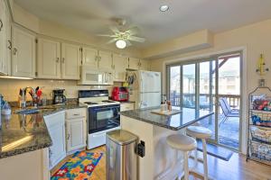 a kitchen with white cabinets and a counter top at Brigantine Beach Block Townhome with 3 Balconies! in Brigantine