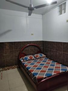 Cama o camas de una habitación en Hotel Eloy Alfaro