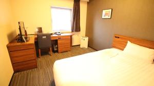 Postel nebo postele na pokoji v ubytování Via Inn Shinagawa Oimachi