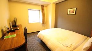 Postel nebo postele na pokoji v ubytování Via Inn Shinagawa Oimachi