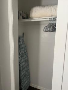 a closet with a door open with a towel at OU-2 bed 2 bath apartment close to OU in Oklahoma City