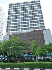 a large building in the middle of a city at Studio 14 Vacation with Pool in Shah Alam City in Shah Alam