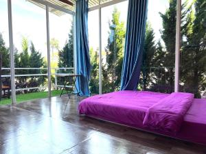 Postel nebo postele na pokoji v ubytování Homestay Vườn Tùng