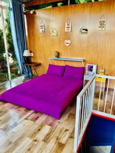 Postel nebo postele na pokoji v ubytování Homestay Vườn Tùng