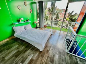 Postel nebo postele na pokoji v ubytování Homestay Vườn Tùng