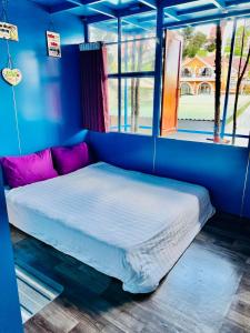 Postel nebo postele na pokoji v ubytování Homestay Vườn Tùng