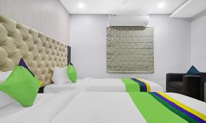 Treebo Kruthika Residency客房内的一张或多张床位