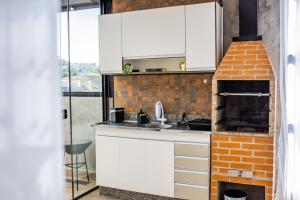 Köök või kööginurk majutusasutuses Uai House com jacuzzi (Espaço romântico)
