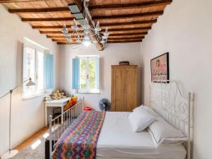 A bed or beds in a room at Holiday Home Gioiella near Trasimeno Lake