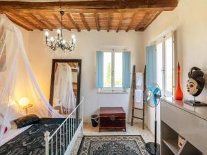 A bed or beds in a room at Holiday Home Gioiella near Trasimeno Lake