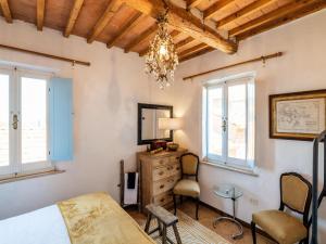 A bed or beds in a room at Holiday Home Gioiella near Trasimeno Lake