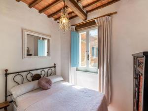 A bed or beds in a room at Holiday Home Gioiella near Trasimeno Lake