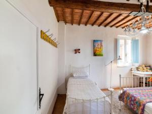 A bed or beds in a room at Holiday Home Gioiella near Trasimeno Lake