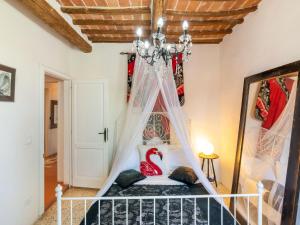 A bed or beds in a room at Holiday Home Gioiella near Trasimeno Lake