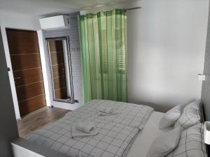 Ένα ή περισσότερα κρεβάτια σε δωμάτιο στο Studio Apartment SILA Rabac