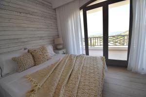 Postel nebo postele na pokoji v ubytování Harmony Villa