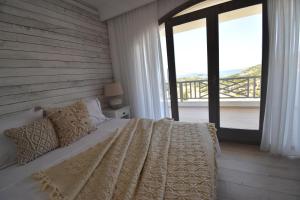 Postel nebo postele na pokoji v ubytování Harmony Villa