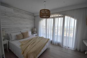 Postel nebo postele na pokoji v ubytování Harmony Villa