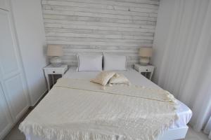 Postel nebo postele na pokoji v ubytování Harmony Villa