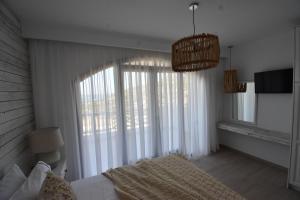 Postel nebo postele na pokoji v ubytování Harmony Villa