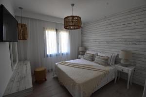 Postel nebo postele na pokoji v ubytování Harmony Villa