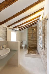 a bathroom with a shower and a sink and a toilet at Jardines de Casablanca in Caravaca de la Cruz +70 photos