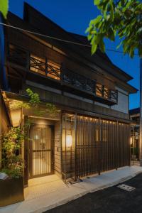 an external view of a building with a gate at THE MACHIYA KAZAHAYA in Kyoto