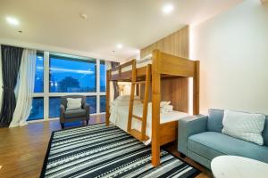 Postel nebo postele na pokoji v ubytování PLAAI Prime Hotel Rayong SHA Extra Plus