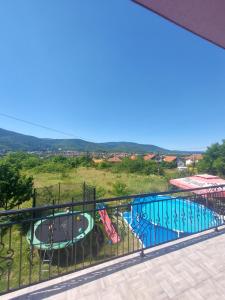a view of a swimming pool from a balcony at Apartmani Đorđević in Soko Banja