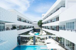 an external view of a building with a swimming pool at Coast Boracay in Boracay