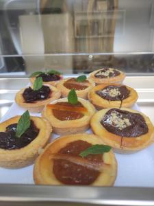 a tray of pastries with mint leaves on them at ELISEO PALACE TROPEA in Tropea