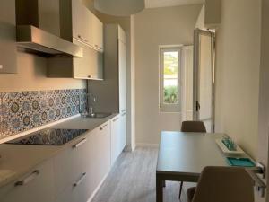 Kuchyňa alebo kuchynka v ubytovaní Address Home I Colori Del Mare