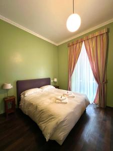 Cama o camas de una habitación en B&B Santi Quattro Al Colosseo