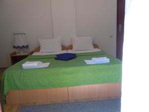 Postel nebo postele na pokoji v ubytování Apartmani Sobe BILJANA