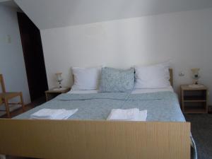 Postel nebo postele na pokoji v ubytování Apartmani Sobe BILJANA
