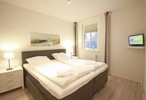 Postel nebo postele na pokoji v ubytování Haus Meeresblick - Ferienwohnung Auszeit (Ref. 136764)