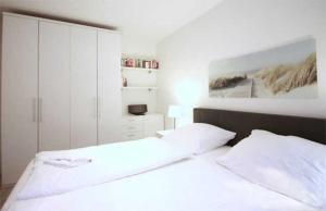 Postel nebo postele na pokoji v ubytování Haus Meeresblick - Ferienwohnung Auszeit (Ref. 136764) + 11 fotografií