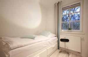 Postel nebo postele na pokoji v ubytování Haus Meeresblick - Ferienwohnung Auszeit (Ref. 136764)